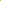 A close-up of the vibrant Quince yellow sheer organza fabric by Super Cheap Fabrics, softly draped and creating gentle waves and folds. This lightweight material allows light to produce subtle highlights and shadows on its surface, enhancing its delicate appearance. The fabric is available in a width of 150cm.