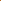 A close-up of Super Cheap Fabrics' Plain Cotton - Marmalade - 150cm displays its rust-orange color, lightweight feel, and smooth, soft folds arranged in a spiral.