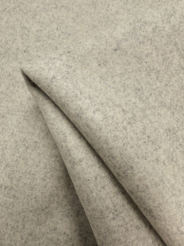A photo of a virgin wool fabric on Super Cheap Fabrics website. This fabric is soft to the touch and is a very luxurious fabric. Holds its structure whilst remaining extremely soft. A heavy weight wool fabric suitable for coats, jackets, overcoats, skirts, and signature luxury pieces. This virgin wool was manufactured in Italy.
