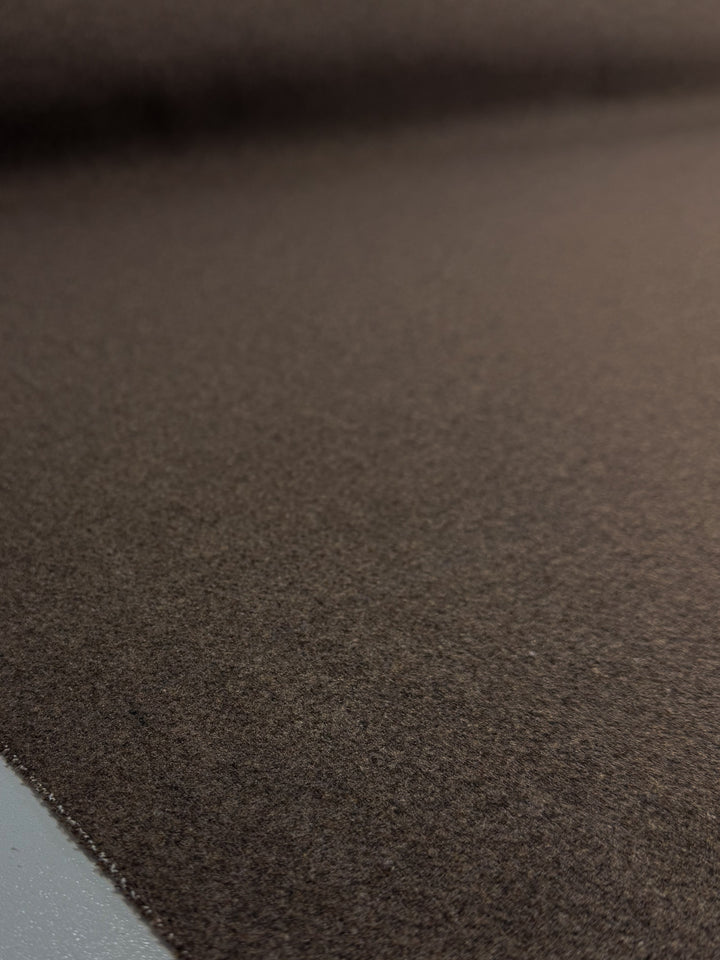 A close-up of Super Cheap Fabrics’ Melton Wool - Shitake (150cm), a heavy weight brown wool fabric with a smooth, slightly textured surface and even color—ideal for outerwear.