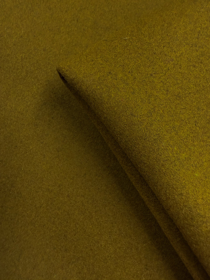 A close-up of Wool Cashmere - Plantation - 155cm by Super Cheap Fabrics, highlighting its soft texture and rich mustard yellow hue—perfect for medium to heavy weight wool projects.