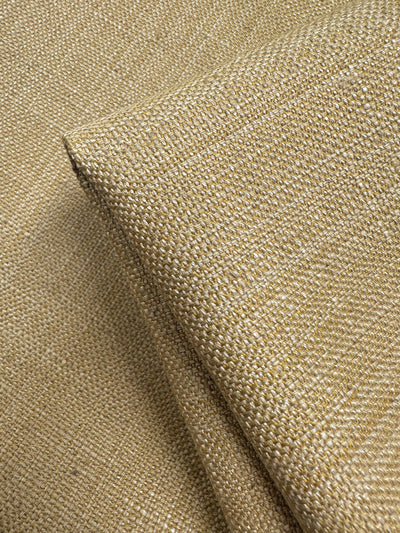 A close-up of Super Cheap Fabrics' Upholstery - Antigua 549 (141cm) highlights its textured beige woven pattern and fine threads—ideal for anyone seeking premium, high-quality upholstery fabric.