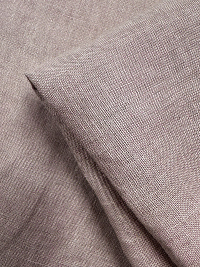 Close-up of Super Cheap Fabrics’ Pure Linen - Zephyr (145cm), in light brown, showing its visible weave, breathable texture, and natural fibers with one piece neatly folded on another.