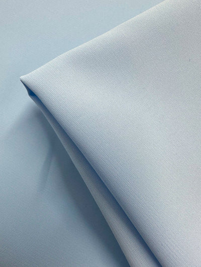 A close-up of Super Cheap Fabrics’ Microfibre Suiting - Nantucket Breeze (150cm): light blue, lightweight polyester with a smooth, tightly woven texture and a clean, minimalistic look.
