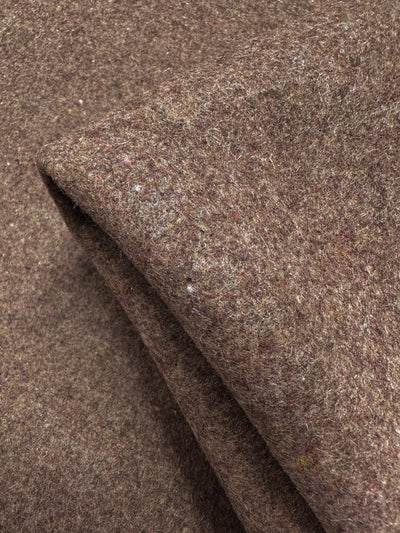 A close-up of Super Cheap Fabrics’ Melton Wool - Cognac (150cm), showing its brown, textured, heavyweight wool with a soft, slightly fuzzy surface, folded to highlight its thickness and luxurious feel.