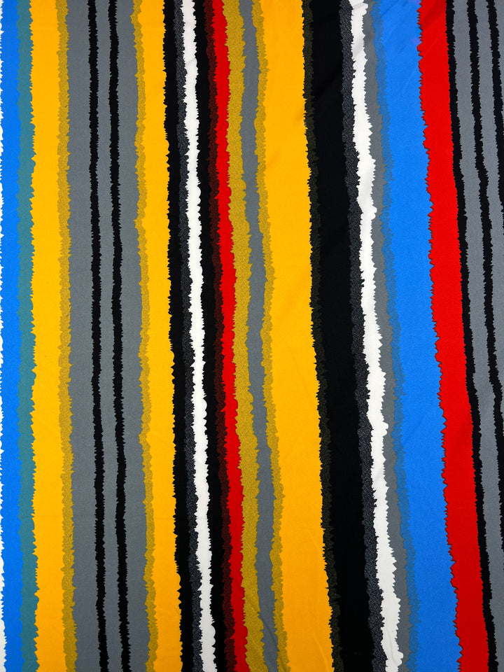 A vibrant abstract pattern featuring vertical jagged stripes in various colors, including yellow, blue, red, black, white, and shades of grey. Perfect for designer fabrics, the Deluxe Print - Neo - 155cm polyester fabric from Super Cheap Fabrics with rough, uneven edges creates a dynamic and energetic appearance.