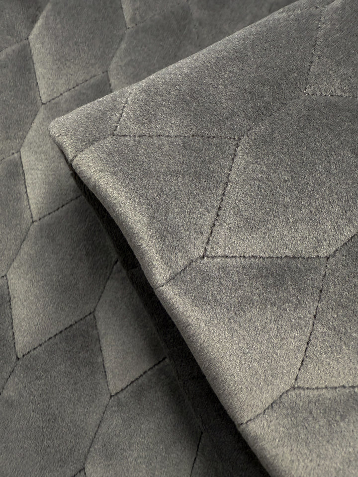 Close-up of Super Cheap Fabrics' Quilted Velvet in Vintage Khaki (145cm), featuring a soft, plush texture and geometric hexagonal stitching—perfect for upholstery or home decor projects.
