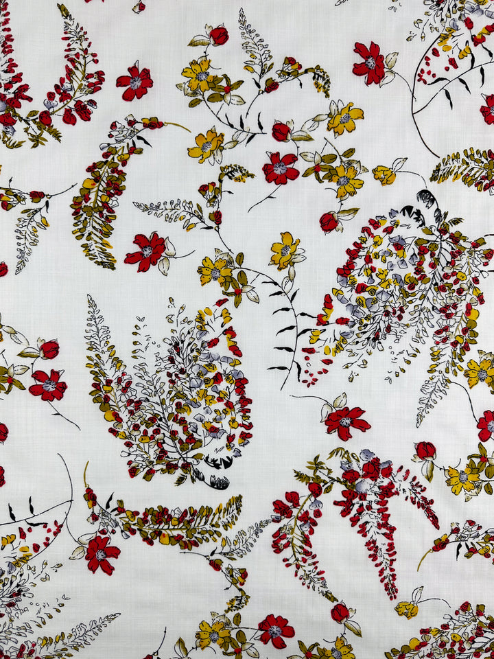 The "Linen Blend - Scarlet Vine - 145cm" from Super Cheap Fabrics features a light, floral pattern with red, yellow, and black flowers on a white background. This vibrant yet delicate fabric is ideal for summer outfits.