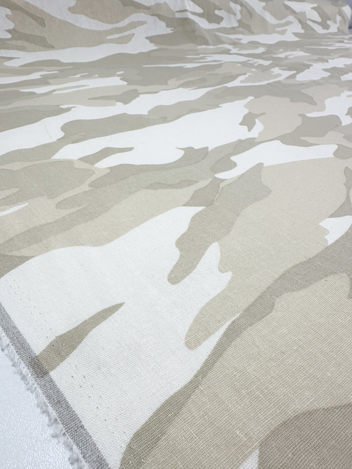 The Linen Blend - Calm Camo by Super Cheap Fabrics features a beige and white camo pattern with abstract shapes for chic home decor, seamlessly blending across the 137cm fabric.