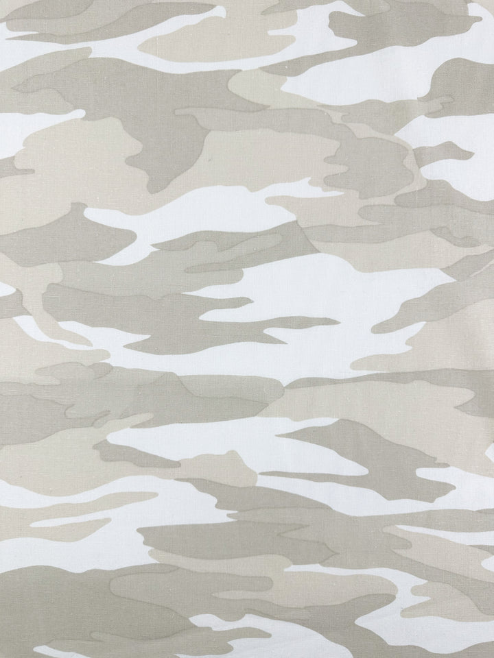 The Linen Blend - Calm Camo by Super Cheap Fabrics features a beige and light grey camouflage pattern with irregular, flowing shapes on a cotton blend. Its evenly distributed design across the 137cm fabric makes it ideal for home decor projects.