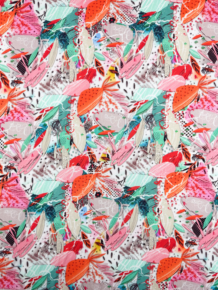 Electric Orchard by Super Cheap Fabrics features a vibrant abstract pattern with overlapping shapes, leaves, dots, and lines on white mercerised rayon (148cm), offering a silky soft touch and lively tropical feel.
