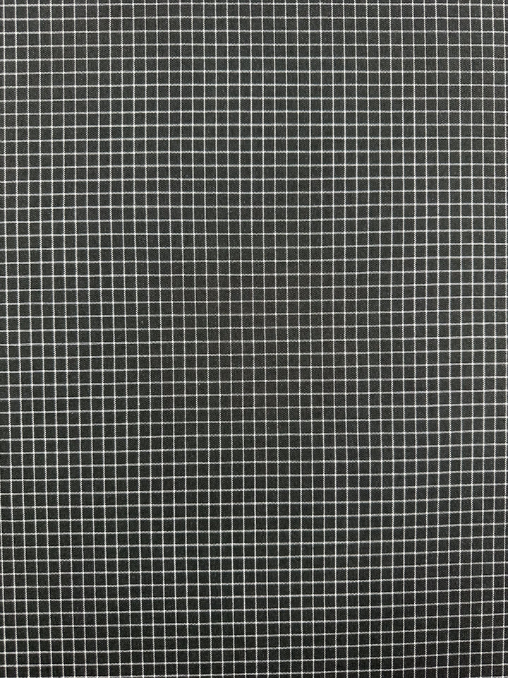A black background with a uniform grid of white lines forming small, evenly spaced squares, perfect for Super Cheap Fabrics' Linen Rayon Grid - Charcoal - 145cm used in home decor items.