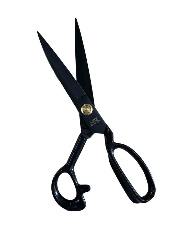 A pair of black metal **Tailor Scissors - Dressmaking Shears** from **Super Cheap Fabrics** with sharp blades made from manganese steel and ergonomic handles is shown against a white background. The threaded pivot point for adjusting tension is visible near the blades, ensuring comfortable weight and precise cutting.
