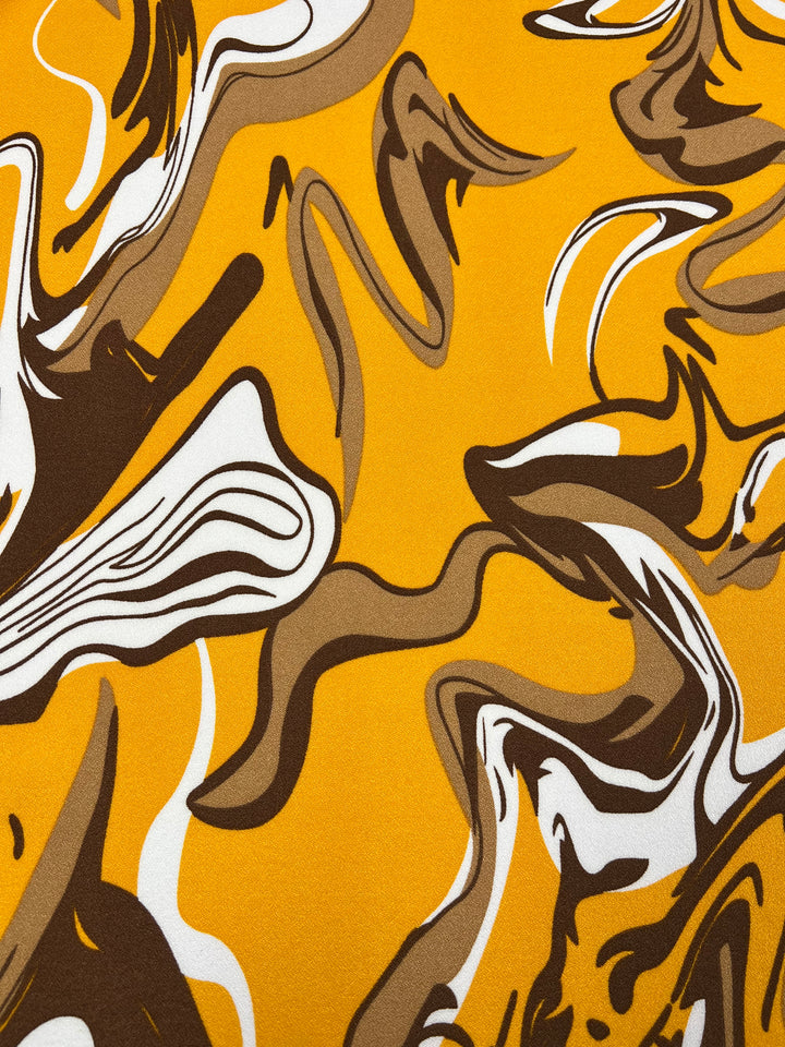 Abstract art reminiscent of Super Cheap Fabrics' *Printed Crepe - Cappuccino - 150cm*, featuring swirling patterns in shades of yellow, brown, black, and white. The design is characterized by dynamic curves and shapes that evoke a sense of movement and fluidity akin to lightweight fabric.